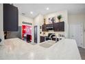 Modern kitchen featuring granite countertops, stainless steel appliances, and dark wood cabinets at 6846 Ashbury Dr, Lakeland, FL 33809