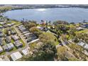 Breathtaking aerial view of the house showcasing its location next to the tranquil lake at 720 Lake Jessie Dr, Winter Haven, FL 33881