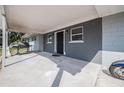 A spacious covered front porch with ample room for seating and entertaining at 808 Spirit Lake Rd, Winter Haven, FL 33880