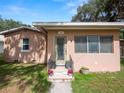 Close up on the home's entrance, with the house number and a neatly landscaped entryway at 116 S Lanier Ave, Fort Meade, FL 33841