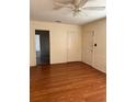 Open concept living room featuring wood-look floors, neutral walls, and a ceiling fan at 1560 Imperial Ave, Bartow, FL 33830