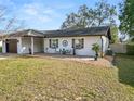 Well-kept one-story home with a cozy front porch and drought-resistant landscaping at 327 Corona Del Mar St, Lakeland, FL 33809