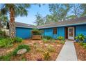 Close up of the exterior showing a nice bench and a walkway leading to the front door at 15 Tera Ln, Winter Haven, FL 33880