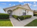 Charming single-story home with well-maintained landscaping and a two-car garage at 1706 Tressel Ct, Winter Haven, FL 33881