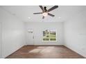 Cozy bedroom features wood-look flooring and a ceiling fan at 2161 Maple Hill Ct, Lakeland, FL 33811