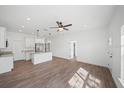 Open-concept living room and kitchen area with recessed lighting at 2161 Maple Hill Ct, Lakeland, FL 33811