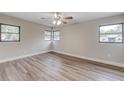 Light-filled bedroom with wood flooring and large windows offering plenty of natural light at 2638 Ralph Rd, Lakeland, FL 33801