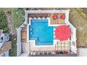 Aerial view of a backyard pool featuring a tanning deck and outdoor seating at 511 Mcrorie St, Lakeland, FL 33803