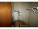 Utility closet features hot water tank and shelving at 6043 Topher Trl # 6043, Mulberry, FL 33860