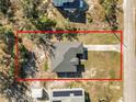 Aerial view of the property showcasing the home's layout, yard, and surrounding area at 151 3Rd Ave, Babson Park, FL 33827