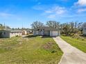 Charming single-story home with a well-maintained lawn and attached one car garage at 151 3Rd Ave, Babson Park, FL 33827