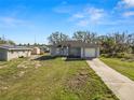Charming single-story home with a well-maintained lawn and attached one car garage at 151 3Rd Ave, Babson Park, FL 33827