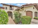 Inviting home with a brown roof, light wall and beautiful, green landscaping at 159 Coventry Cir, Haines City, FL 33844