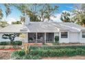 This charming home includes a screened-in porch perfect for enjoying outdoor living in comfort and style at 21 Townhill Dr, Eustis, FL 32726