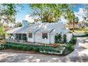 Single-story house boasts a pristine lawn, fenced yard, and freshly painted exterior, radiating curb appeal at 21 Townhill Dr, Eustis, FL 32726