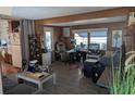 Cozy living area with wood paneling, laminate flooring, and natural light at 3030 Sun Way, Lakeland, FL 33801