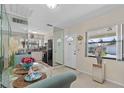 Dining area with kitchen view, with mirrored walls, dining table and chairs at 3158 Pebble Bend Dr, Lakeland, FL 33810
