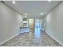 Bright living room boasts tile floors with an eat-in kitchen bar adding character and functionality at 4202 Teeling Ct, Auburndale, FL 33823