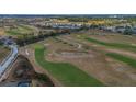 Expansive aerial view of the lush green golf course with sand traps and manicured fairways at 435 Gleneagles Dr, Davenport, FL 33897