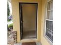 A view of the entryway with tile flooring and a glimpse of the interior at 5407 Quarry Rock Rd, Lakeland, FL 33809