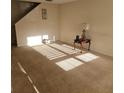 Spacious living room with carpeted floors and abundant natural light, creating a warm and inviting atmosphere at 5407 Quarry Rock Rd, Lakeland, FL 33809