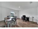 Open concept dining area with wood-look floors and natural light at 6296 Dolostone Dr, Lakeland, FL 33811