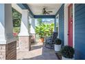 Comfortable porch featuring a rocking chair and views of lush foliage at 631 W Park St, Lakeland, FL 33803