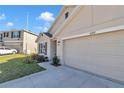 Exterior of a well-maintained home with a two-car garage and neat front garden at 6769 Se 3Rd Loop, Ocala, FL 34472