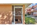 A screened front porch protects the front door, while allowing sunlight and airflow into the entry at 8303 Waterview Way # 8303, Winter Haven, FL 33884