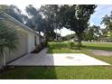 View of concrete patio, lawn, and garden areas at 1065 Jordan Rd, Lakeland, FL 33811