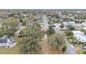 Overhead shot showcasing the property's location in a neighborhood setting with mature trees at 1243 Olive St, Lakeland, FL 33815