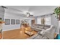 Open living room with hardwood floors offers great flow into dining area at 2330 Peterson Rd, Lakeland, FL 33812