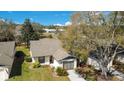 Cozy single-story home featuring well-maintained landscaping, a driveway, and a one-car garage at 29 Buck Cir, Haines City, FL 33844