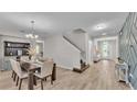 Bright entryway with staircase, chandelier, and decorative wall at 3965 Aquilla Dr, Lakeland, FL 33810