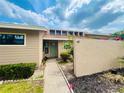 Charming single-story home featuring a walkway to the front door at 5225 Imperial Lakes Blvd # 49, Mulberry, FL 33860