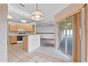 Well-lit kitchen with tile flooring, ample counter space, and stainless steel appliances at 5725 Mallard Dr, Lakeland, FL 33809