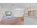 Bright living room with sliding glass doors leading to a screened-in patio at 5725 Mallard Dr, Lakeland, FL 33809