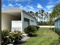 Property includes manicured landscaping and a covered carport perfect for additional parking at 1155 Motorcoach Dr, Polk City, FL 33868