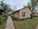 A charming exterior view of the property showcasing well-maintained landscaping and inviting curb appeal at 320 Eron Way # 6, Winter Garden, FL 34787