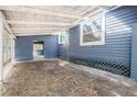 Open carport area featuring the side entrance and ample open space at 6029 Tancrede Ct, Lakeland, FL 33811