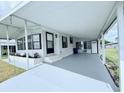 Spacious covered carport leading to the front entrance of the single-story home at 1007 Elizabeth Ln, Lakeland, FL 33809