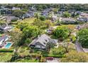 Beautiful aerial view of the property showcasing mature trees, landscaping, and neighborhood at 1842 Pinnacle Dr, Lakeland, FL 33813