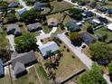 Residential neighborhood with a well-maintained single-story home, surrounded by lush greenery and tree-lined streets at 3166 Valley Vista Cir, Lakeland, FL 33812