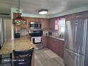 Well-equipped kitchen featuring stainless steel appliances, granite countertops, and ample cabinet space at 1810 Blue Lake Dr, Lakeland, FL 33801