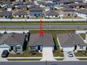 Birds-eye view of the home in a neighborhood with similar homes and fenced yards, close to neighborhood street at 3843 Resting Robin Ave, Bartow, FL 33830