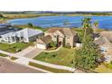 Beautiful two-story home overlooking a tranquil lake, nestled in a peaceful neighborhood at 4512 Brookshire Pl, Lake Wales, FL 33898