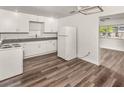 Eat-in kitchen featuring sleek white cabinetry and modern appliances at 604 W 10Th St, Lakeland, FL 33805