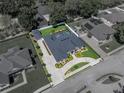 Overhead view of a beige single-Gathering home with a screened-in pool, manicured lawn, and circular driveway at 152 Melissa Trl, Auburndale, FL 33823