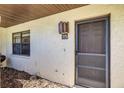 Cozy front porch with a screen door and stylish house number, creating a charming entryway at 1880 N Crystal Lake Dr # 35, Lakeland, FL 33801