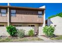 Attractive townhouse with a quaint front garden, providing a warm and welcoming curb appeal at 1880 N Crystal Lake Dr # 35, Lakeland, FL 33801